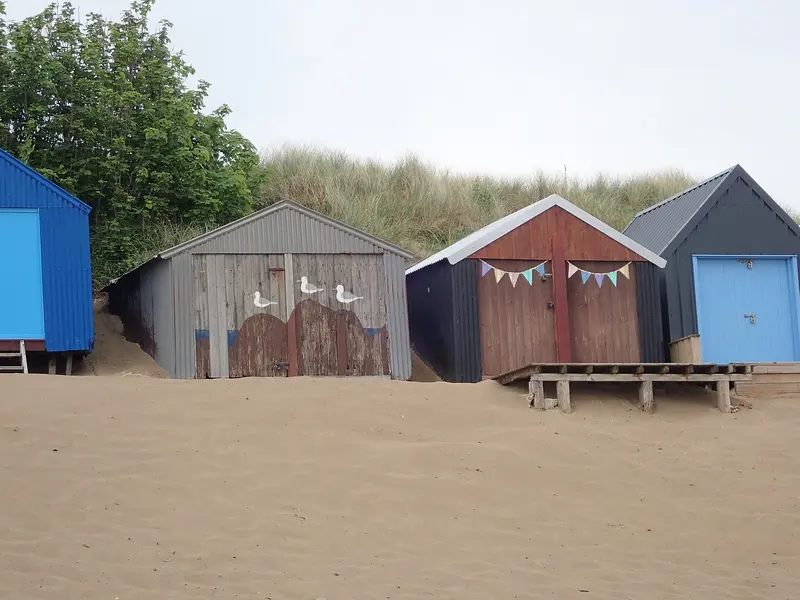 Beach huts by the dunes